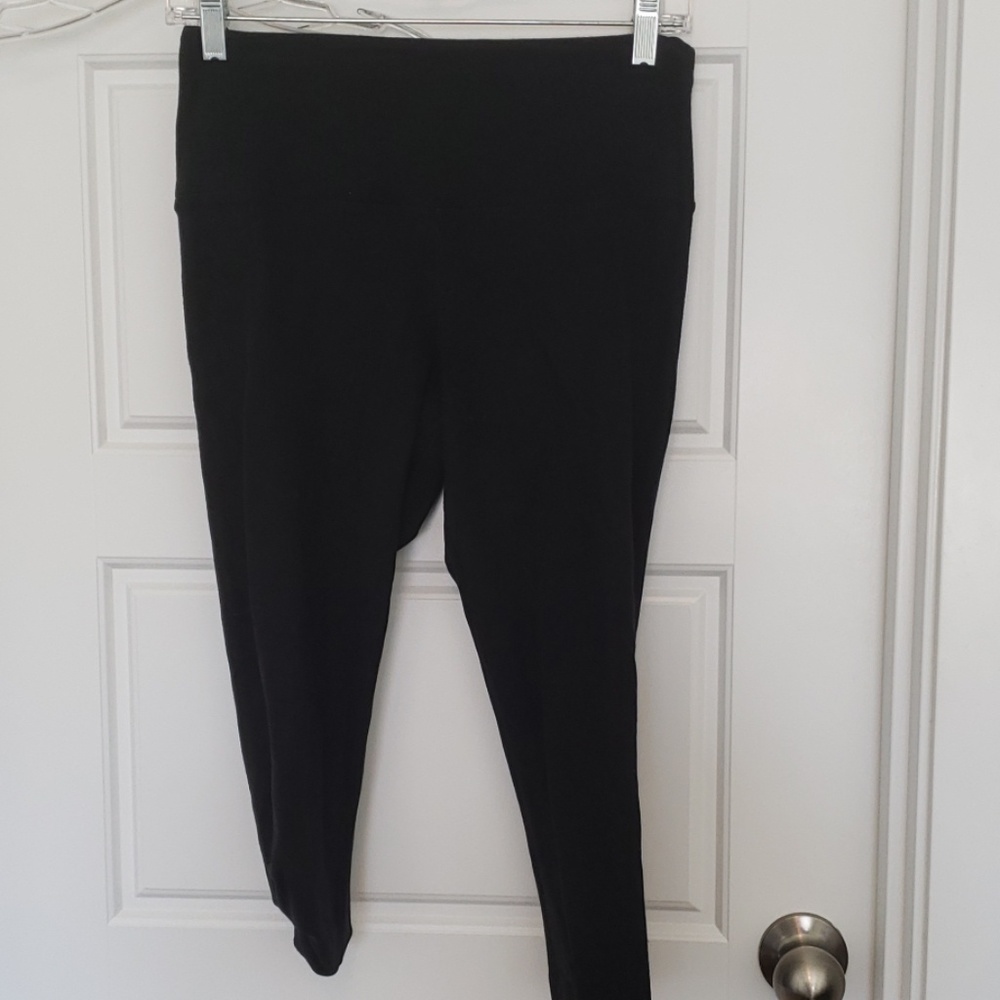 Worn black capri leggings